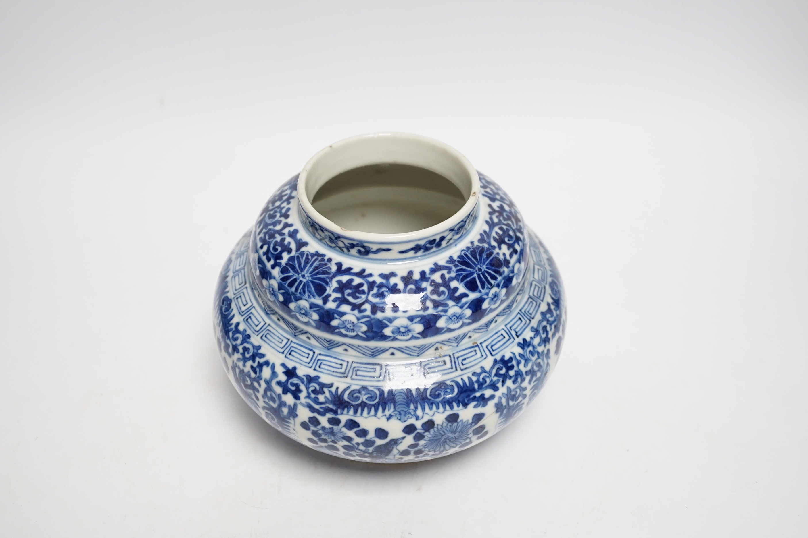 A late 19th century Chinese blue and white floral jar and cover, seal mark, 17cm high